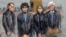 In this courtroom sketch, Dzhokhar Tsarnaev (2nd from left) is depicted standing with his defense attorneys William Fick (L) Judy Clarke (2nd from R), and David Bruck (R) as the jury presents its verdict in his federal death penalty trial, April 8, 2015, 