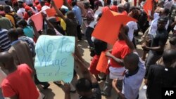 FILE: Zimbabwean workers demonstrate against the high cost of living and low wages in Harare, Saturday, April, 11, 2015. Hundreds of workers took to the streets of Harare in an effort to stop the Zimbabwean government from passing laws that will make it easy for it to dismiss workers as the country battles with a high unemployment rate.( AP Photo/Tsvangirayi Mukwazhi)