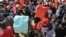 FILE: Zimbabwean workers demonstrate against the high cost of living and low wages in Harare, Saturday, April, 11, 2015. (AP Photo/Tsvangirayi Mukwazhi)