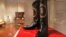 FILE - A pair of Ronald Reagan's cowboy boots sit in a case at Christie's prior to an auction in New York, Sept, 16, 2016. The boots sold Friday for $199,500.