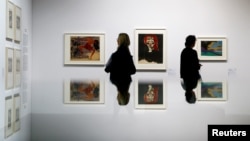 Two women look at works of art during a media preview at the exhibition "Gurlitt: Status Report Degenerate Art confiscated and sold" at the Kunstmuseum in Bern, Switzerland, Nov. 1, 2017. 