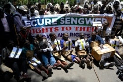 FILE - Members of Sengwer community living in Embobut forest, Elgeyo Marakwet, present a petition seeking to stop eviction from the forest and be recognized as a distinct tribe, in Nairobi, Oct. 7, 2019.