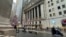 FILE - A scooter passes the New York Stock Exchange in New York's Financial District, Dec. 17, 2024. Stock prices fell Feb. 7, 2025, as investors fretted about inflation and tariffs.