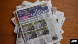 An arrangement of UK daily newspapers photographed as an illustration in Brenchley, Kent, March 9, 2021, shows front page headlines reporting on the story of the interview given by Meghan, Duchess of Sussex, wife of Prince Harry, to Oprah Winfrey.