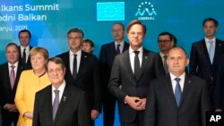 FILE - European Union and Western Balkans leaders stand during a group photo at the EU-Western Balkans summit, at the Brdo Congress Center in Kranj, Slovenia, Oct. 6, 2021.