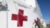 FILE - Boatswain's Mate 3rd Class Nathaniel Miller, left, and Logistics Specialist Seaman Apprentice Seth Stevens unmoor lines as the hospital ship USNS Comfort departs Norfolk, Va., June 14, 2019.