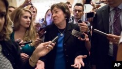 Sen. Susan Collins, R-Maine, is surrounded by reporters on Capitol Hill in Washington, July 13, 2017, after a revised version of the Republican health care bill was announced by Senate Majority Leader Mitch McConnell of Kentucky.