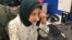 WHBF-TV Reporter Tahera Rahman works the phones to set up a potential news story.