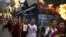 Exile Tibetans carry torches as they participate in a candlelit vigil in Dharmsala, India, June 21, 2012.