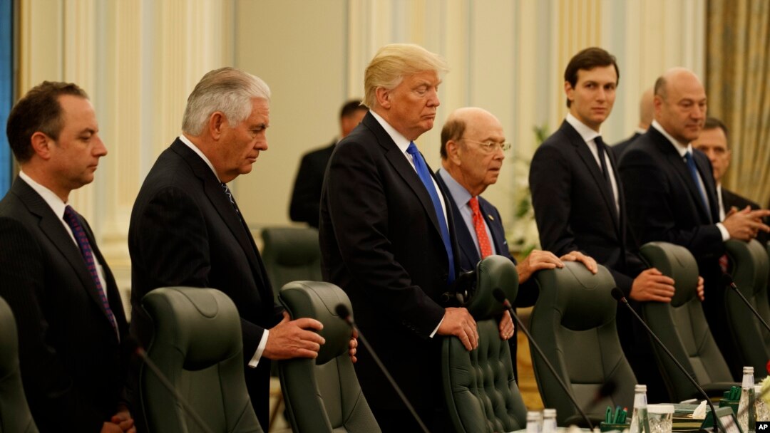 President Donald Trump waits for the beginning of a bilateral meeting with Saudi King Salam at the Royal Court Palace, Saturday, May 20, 2017, in Riyadh. From left are, White House Chief of Staff Reince Priebus, Secretary of State Rex Tillerson, Trump, Commerce Secretary Wilbur Ross, White House senior adviser Jared Kushner, and Chief Economic Adviser Gary Cohn.