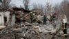 Rescuers work at a site of a residential house damaged during a Russian missile strike, amid Russia's attack on Ukraine, in Kyiv, Ukraine Dec. 29, 2022. 