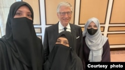 Fiza Bibi, middle, is photographed with Bill Gates, the co-chair of the Bill & Melinda Gates Foundation, in Islamabad, Pakistan, June 2024.