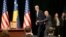Kosovo Prime Minister Isa Mustafa welcomes U.S. Secretary of State John Kerry to a joint press conference after Kerry's arrival in Kosovo's capital Pristina airport, Dec. 2, 2015. 