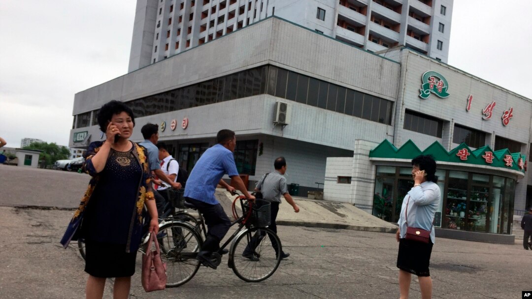 Residents go about their business near one of the city’s biggest department stores and shopping areas in Pyongyang, North Korea, June 10, 2018. 