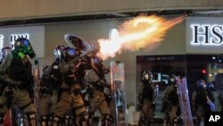 Riot police fire tear gas during the anti-extradition bill protest in Hong Kong, Aug. 11, 2019. 