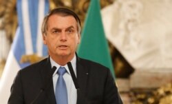 FILE - Brazil's President Jair Bolsonaro talks at the government house in Buenos Aires, Argentina, June 6, 2019.