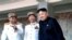 2012年4月15日,金正恩(右)与李英浩(左)及崔龙海(中)在金日成百岁冥诞的阅兵仪式上
