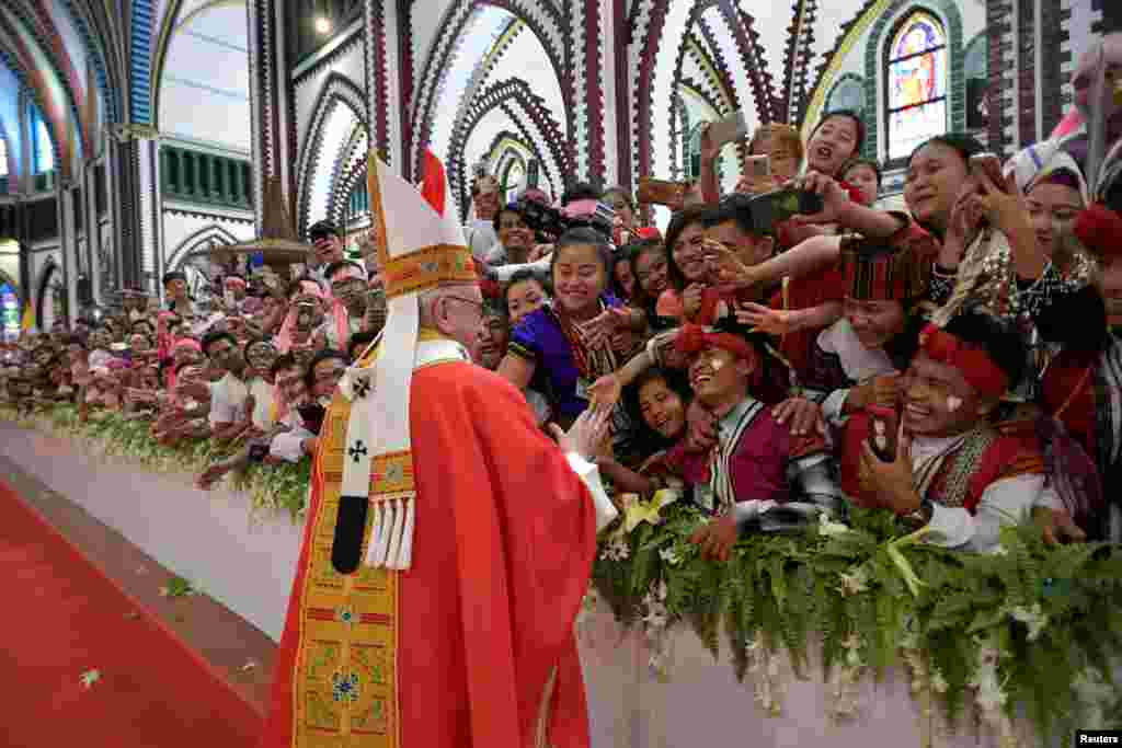 Pope Francis blesses faithful during a Mass at St Mary's Cathedral in Yangon