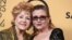 Debbie Reynolds, winner of the Screen Actors Guild lifetime award (left) and Carrie Fisher pose in the press room at the 21st annual Screen Actors Guild Awards at the Shrine Auditorium, Jan. 25, 2015, in Los Angeles. 