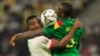 Soccer Football - Africa Cup of Nations - Group A - Cameroon v Burkina Faso - Olembe Stadium, Yaounde, Cameroon - January 9, 2022 Cameroon's Michael Ngadeu-Ngadjui in action with Burkina Faso's Issa Kabore REUTERS/Thaier Al-Sudani