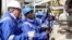 Late Ghanaian President John Atta Mills turns on the valve to allow the first barrel of crude to flow from the Jubilee offshore oil field on Dec. 15, 2010.