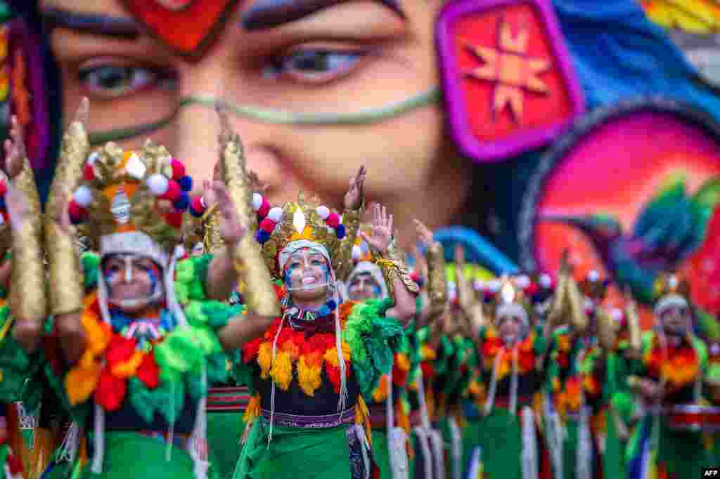 Artists perform during the Blacks and Whites Carnival in Pasto, Colombia, Jan. 6, 2021.