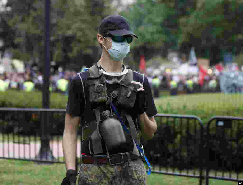 A White nationalist is shown during a rally near the White House on the one year anniversary of the Charlottesville "Unite the Right" rally, Sunday, Aug. 12, 2018, in Washington.