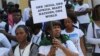 FILE - African students participate in a protest against the alleged assault of Tanzanian woman in Bangalore, India on Feb. 6, 2016. 