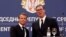 French President Emmanuel Macron and Serbian President Aleksandar Vucic shake hands after a joint news conference at the Serbia Palace building in Belgrade, Serbia, July 15, 2019. 