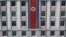 FILE - A pedestrian walks past a North Korean flag displayed on a building in Pyongyang, North Korea, April 12, 2019.