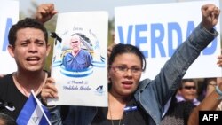 Anti-government protesters demonstrate outside the Cathedral of Managua, May 17, 2019, after political prisoner Eddy Montes died during a riot inside La Modelo maximum security prison.