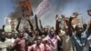 Residents take to the streets to protest the results of the Orange Democratic Movement primary elections the town of Kisumu in western Kenya, January 20, 2013. 