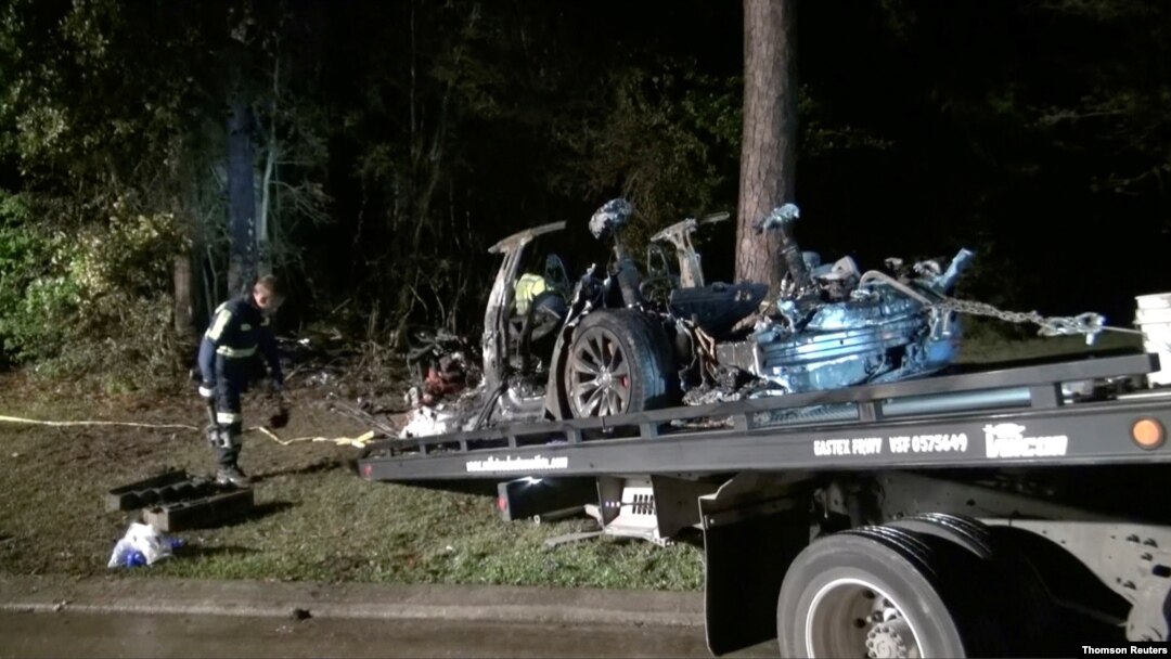The remains of a Tesla vehicle are seen after it crashed in The Woodlands, Texas