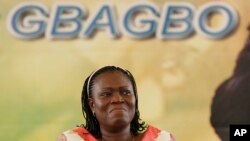 FILE - Simone Gbagbo, wife of Laurent Gbagbo, reacts during a pro-Gbagbo rally in Abidjan, Ivory Coast, Nov. 22, 2012.