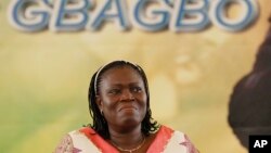 FILE - Simone Gbagbo, wife of Laurent Gbagbo, reacts during a pro-Gbagbo rally in Abidjan, Ivory Coast, Nov. 22, 2012.