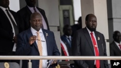 FILE - South Sudan's President Salva Kiir, right, and Vice President Riek Machar, left, attend a Holy Mass led by Pope Francis at the John Garang Mausoleum in Juba, South Sudan, Feb. 5, 2023. 