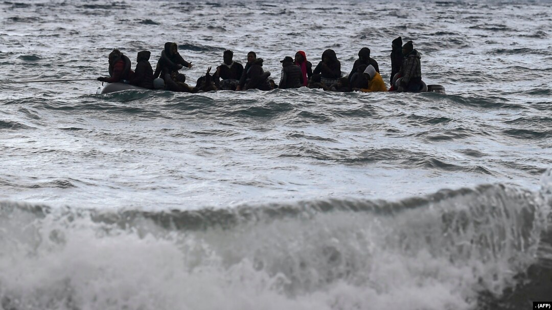 A dinghy transporting 27 refugees and migrants originating from Gambia and the Republic of Congo is pulled towards Lesbos island after being rescued by a war ship during their sea crossing between Turkey and Greece on February 29, 2020. (Photo by ARIS MESSINIS / AFP)