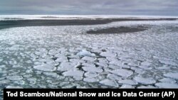 his January 2017 photo provided by Ted Scambos shows sea ice on the ocean surrounding Antarctica during an expedition to the Ross Sea.