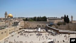Visitors are seen at the Western Wall, the holiest site where Jews can pray in Jerusalem's Old City, June 26, 2017. 