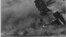 FILE - A view of the USS Arizona burning after the Japanese attack on Pearl Harbor in Hawaii, Dec. 7, 1941. 