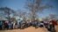 Voters queue to cast their votes at a polling station in Gaberone, Botswana, Oct. 24, 2014.