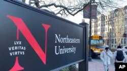 Students walk on the Northeastern University campus in Boston, Massachusetts, Jan. 31, 2020. As concerns about China's virus outbreak spread, universities all over the world are scrambling to assess the risks to their programs.