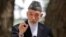 FILE - Afghan President Hamid Karzai speaks during a press conference at the presidential palace in Kabul, Aug, 24, 2013. 