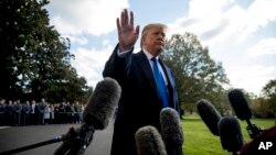 President Donald Trump waves off a question from a reporter on the South Lawn of the White House, in Washington, Nov. 8, 2019.