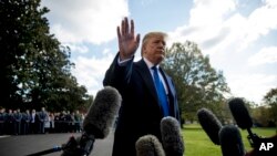 President Donald Trump waves off a question from a reporter on the South Lawn of the White House, in Washington, Nov. 8, 2019.