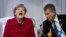 Almanya Başbakanı Angela Merkel Lahey'de Finlandiya Sauili Niinisto ile görüşmesinde kahkaha atarken 