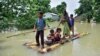 Villagers row a makeshift raft through a flooded field to reach a safer place at the flood-affected Mayong village in Morigaon district, in the northeastern state of Assam, India, June 29, 2020. 