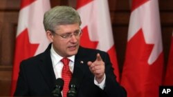 FILE - Canadian Prime Minister Stephen Harper is seen speaking on Parliament Hill in Ottawa.