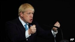 Britain's Prime Minister Boris Johnson during a speech on domestic priorities at the Science and Industry Museum in Manchester, England, Saturday July 27, 2019.