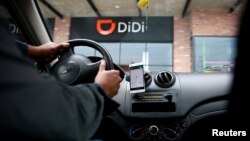 A new driver's mobile phone is seen with the app of Chinese ride-hailing firm, outside the new drivers center in Toluca, Mexico, April 23, 2018. 
